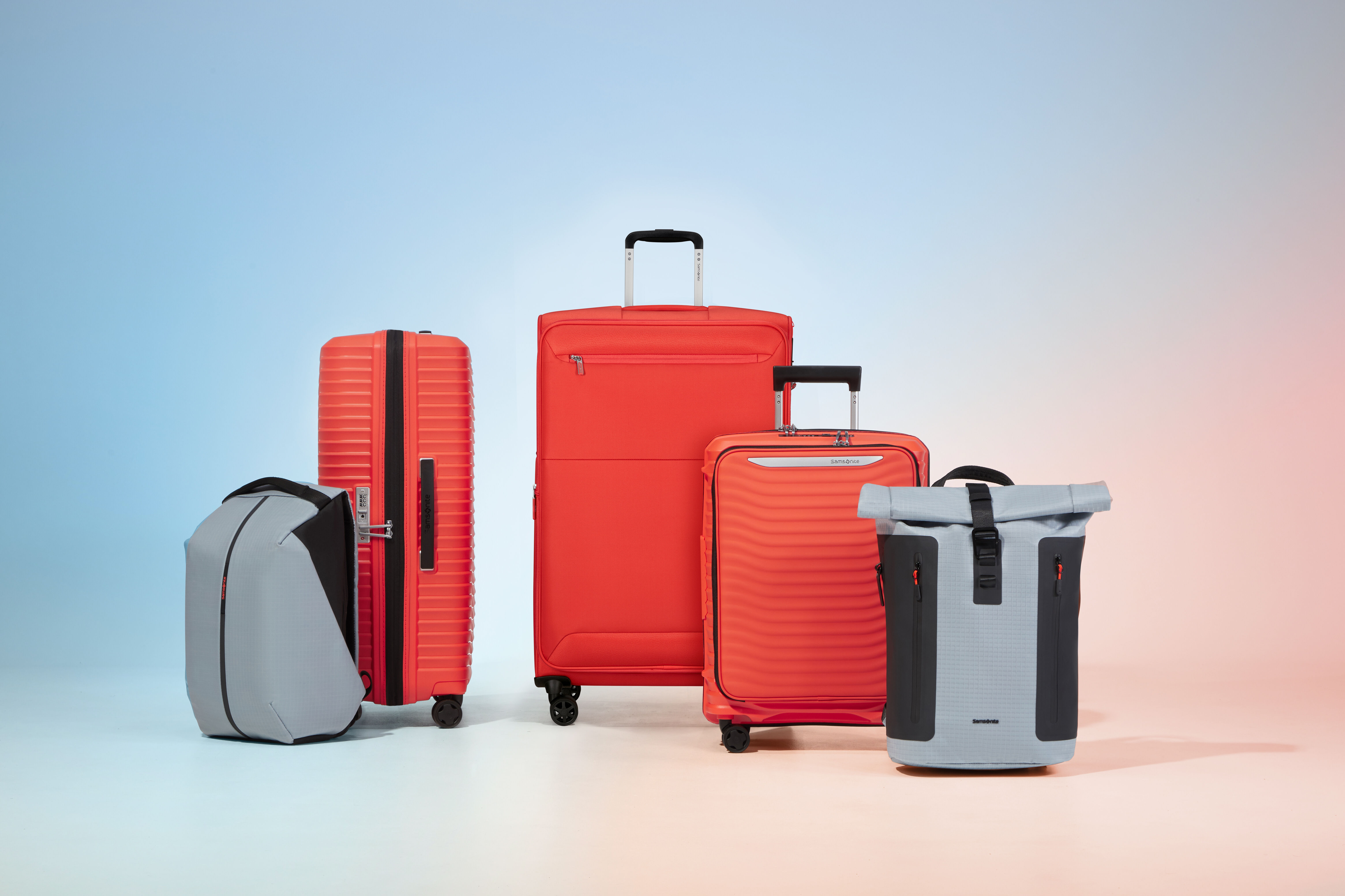 Hardside and softside suitcases side by side, comparing the two luggage types
